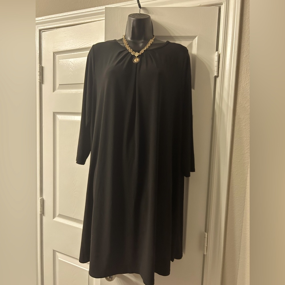 Little Black Dress. Very versatile  3/4 length sleeves. Knee length Size XL.